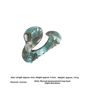 Detailed view of green marbled acetate claw clip showing dimensions 6x4.5cm and 14.7g weight