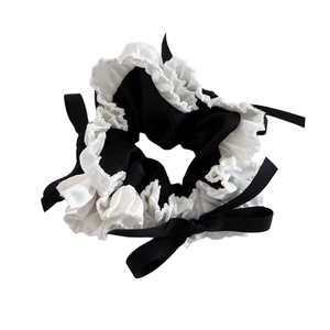 Ballet style satin hair scrunchie with lace trim and black bow decoration