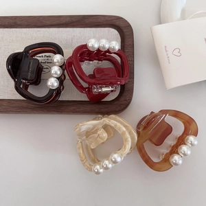Pinces à cheveux élégantes en acétate avec perles, couleurs marron, marbre et ambre