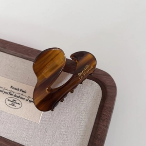 Tortoiseshell acetate hair claw clip with golden Barrette La France text engraving