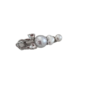 Bowknot hair clip with sparkling rhinestones and white pearls on a silver metal base