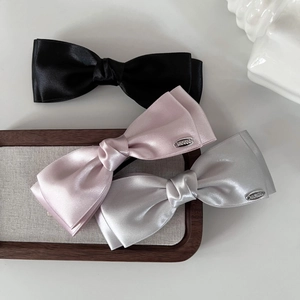 Satin bow hair clips set in black, pink and silver grey with elegant double-layered design