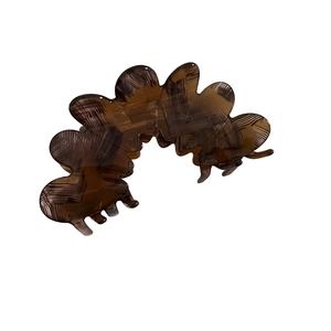 Elegant dark brown acetate hair claw clip with shell texture and wavy design