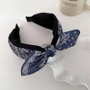 Retro paisley print wide headband with large bow in navy blue for a stylish look