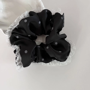Polka dot hair scrunchie with white lace edges and Blind for Love text label