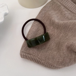 Detail showing the curved emerald resin rectangle with FRANCE Handmade engraving on band