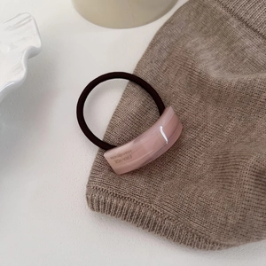 Minimalist acetate hair tie with pink curved rectangle ornament and brown elastic band
