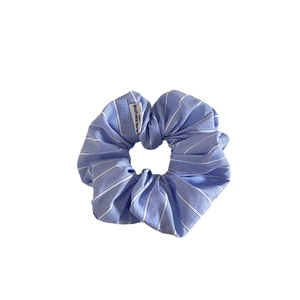 Elegant light blue striped fabric scrunchie for low ponytail styling and bun hair accessory