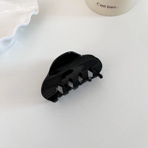 Classic large black acetate shark hair claw clip in a minimalist French style for women