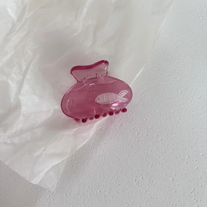 Translucent pink hair claw clip with white fish pattern and bubble details