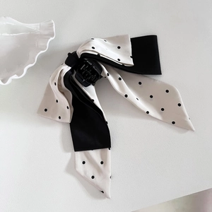 Elegant French style bow hair claw clip with black and white polka dot ribbon design