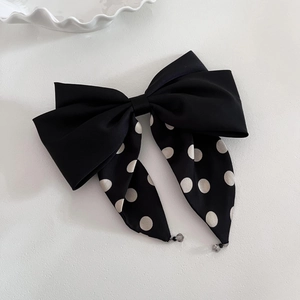 French style black satin hair clip with white polka dot bow and hanging bead detail