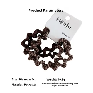 Detail showing 6cm diameter and 10.8g weight of brown wavy zebra pattern hair ties