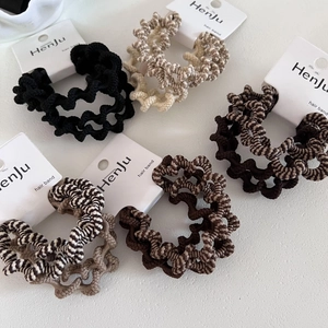 Set of 4 wave zebra pattern hair ties in coffee and cream tones on display card