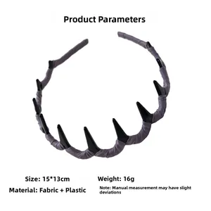 Detail view of purple fabric headband with black spikes, size 15x13cm, weight 16g
