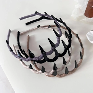 Detail of fabric wrapped wave headbands with non-slip teeth in four pastel colors