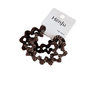 Brown zebra pattern and solid dark brown elastic wave hair ties set on white card