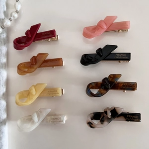 Chic acetate bow hair clips in eight assorted colors with France Handmade engraving