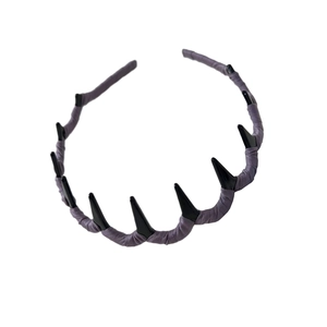 Gothic purple fabric headband with black punk spikes on a clean white background