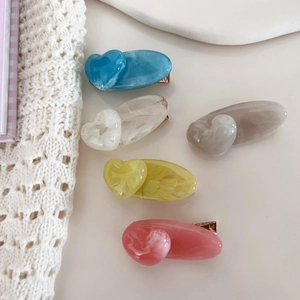 Acrylic marble hair clip set featuring heart shapes and soft pastel colors for women