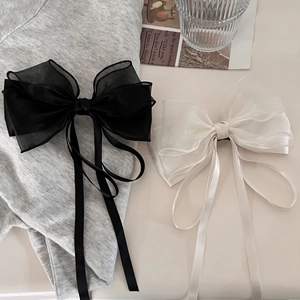 Elegant black and white organza ribbon bow hair clip with long flowing streamers