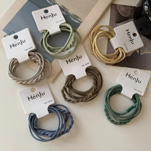 Detailed view of high-elastic braided hair bands in assorted Morandi colors on white card