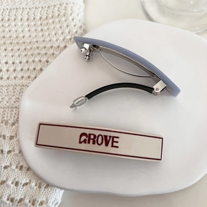 Chic Korean style acetate hair clip set with GROVE letter print on white ceramic tray