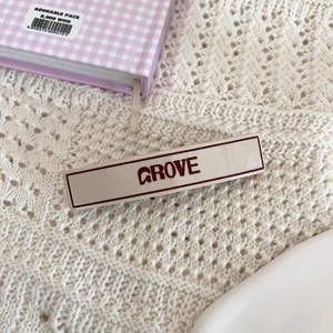 Minimalist cream GROVE rectangular hair clip on elegant lace fabric background