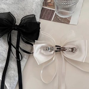Elegant black and cream organza bow hair clips with metal spring fasteners for women