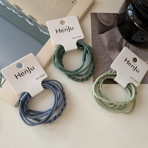 Detail showing braided high-elastic hair bands in Morandi colors with white display cards