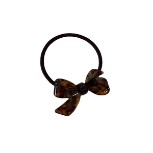 Minimalist tortoiseshell pattern bow hair tie made of acetate with black elastic band