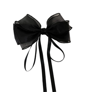 Elegant black tulle bow hair clip with long ribbons on a clean white background
