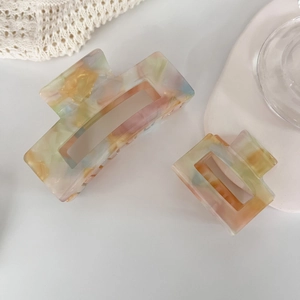 Iridescent acetate square hair claws in colorful mosaic pattern for women's hairstyling