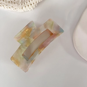 Chic iridescent acetate hair claw clip with colorful marble pattern for elegant updos