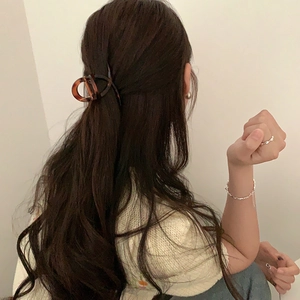 Elegant tortoise shell hair claw clip in D-shape design for French style hairstyles