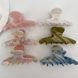 Set of 6 textured acetate claw clips in pastel colors and marble patterns for hair styling