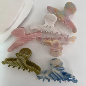 Set of six large acetate claw clips with marble texture and tie-dye patterns for women