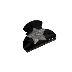 Y2K millennium style black claw clip with silver glitter star decoration for women