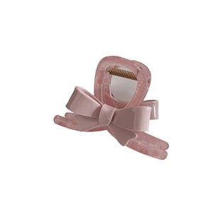 Pince à cheveux élégante avec nœud rose en acrylique et base en forme de cœur