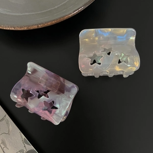 Hollow star pattern acetate hair claw clips in iridescent purple and white marble finish