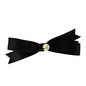 Elegant black ribbon bow hair clip with a gold Jayro White engraved metal pendant