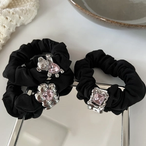 Three black satin scrunchies with silver bear and flower charms with pink crystals