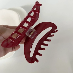 Large dark red acetate shark hair claw clip with glossy finish and strong metal spring