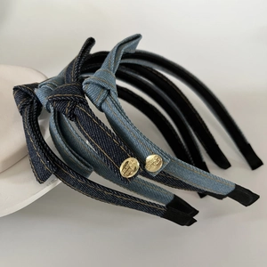 Set of four vintage denim headbands with gold metallic tags and decorative knots