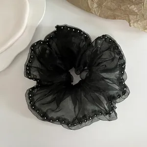 Oversized black mesh scrunchie with silver bead trim shown from the back view