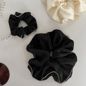 Elegant satin hair scrunchies with faux pearl edges in black and cream white colors