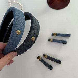 Denim headband and hair clip set in light and dark blue with golden metal labels