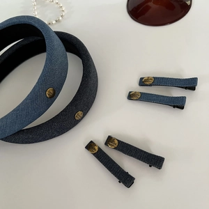 Denim headband and hair clip set with gold logo accents for a vintage high crown look