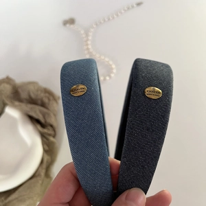 Retro denim sponges headbands with gold metallic labels in dark blue and light blue colors