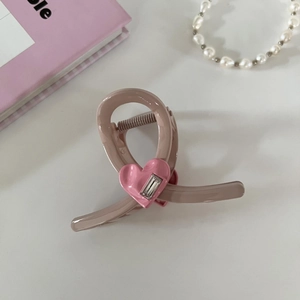 Detailed view of dusty pink hair claw clip with heart and rectangular rhinestone